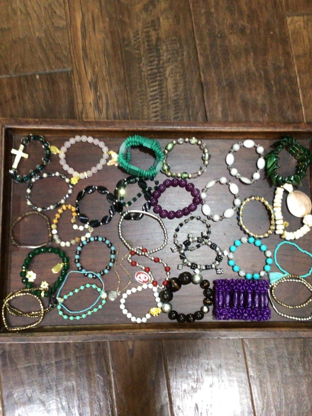 Tray of stretchy band bracelets. All wearable could also be used for crafts.
